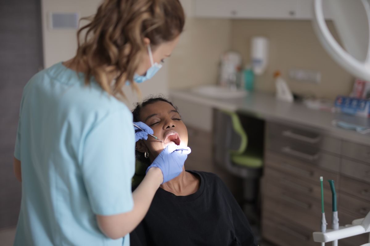 Dentist carrying out careful restorative treatment